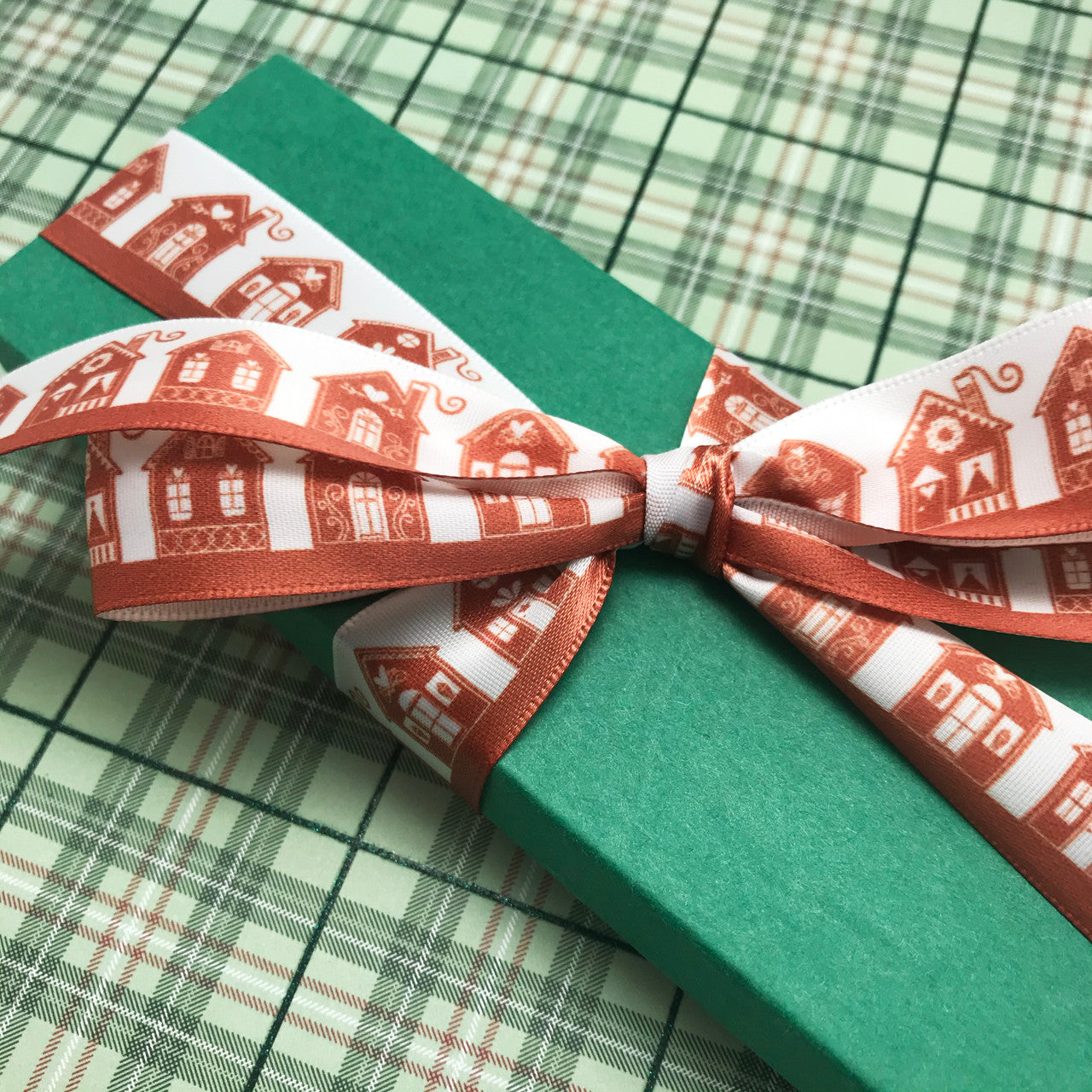 Ginger bread ribbon tied on a green box is the perfect gift for the baker in your life!
