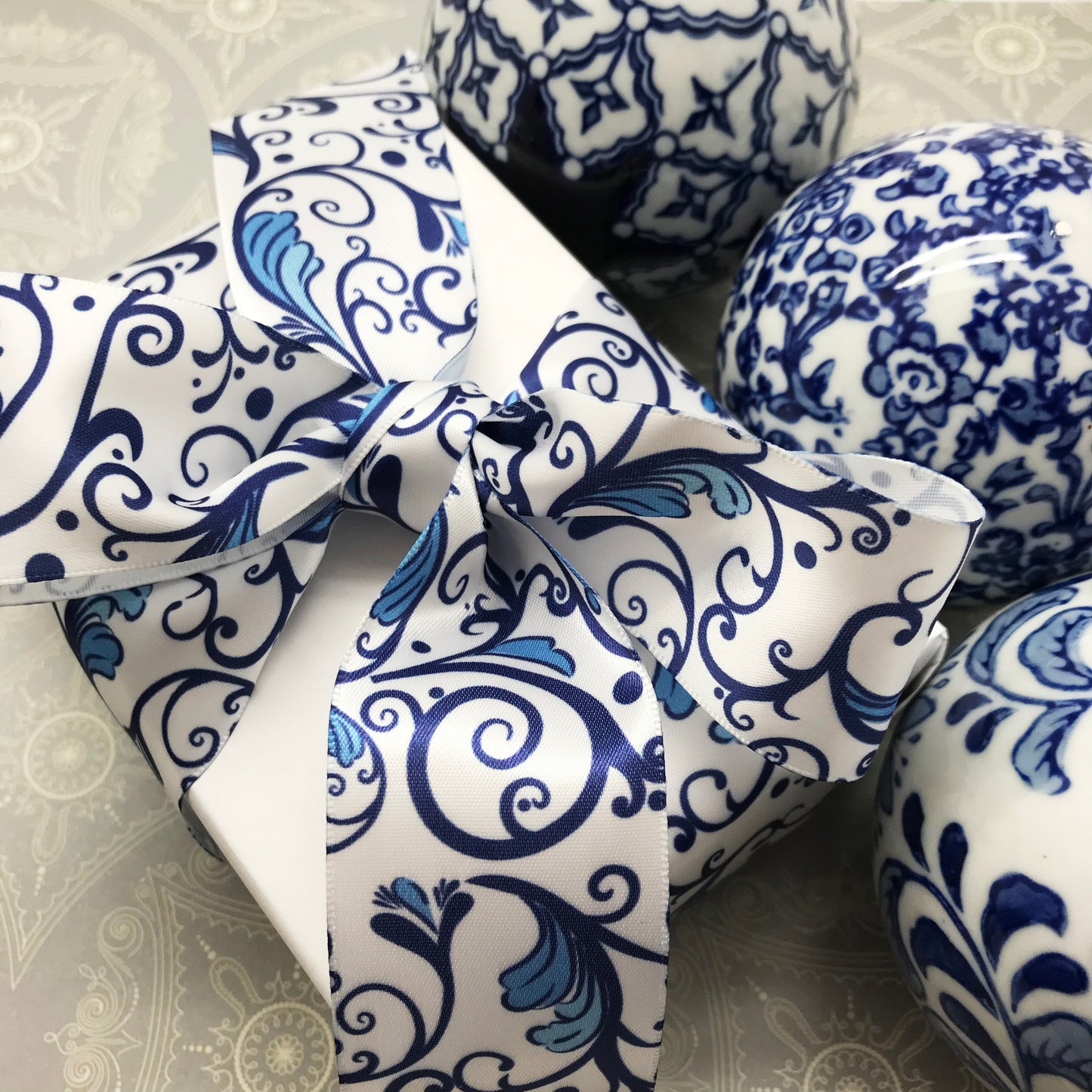 Chinoiserie Ginger jar filigree design ribbon in blue and white printed on 1.5" white single face satin