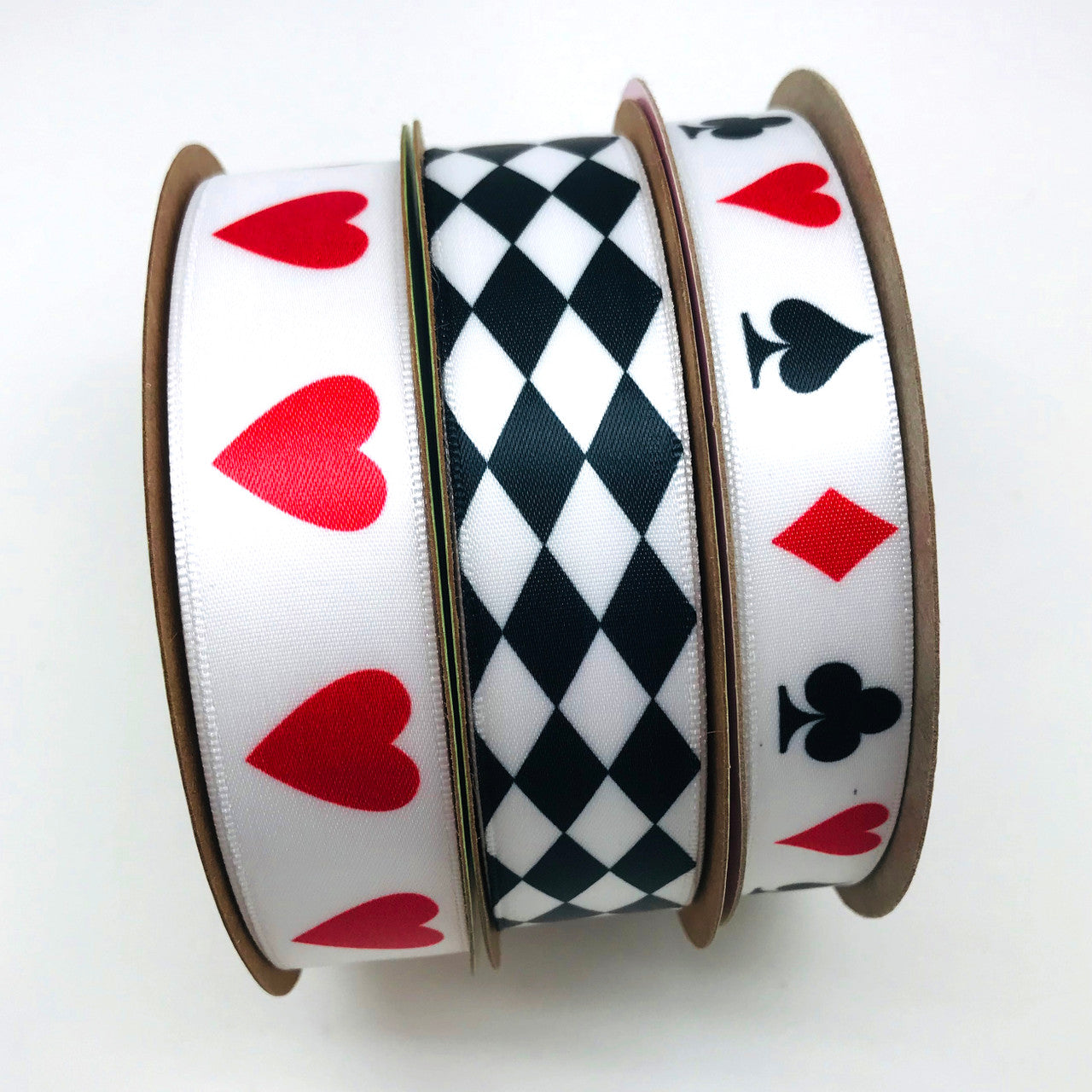 Thinking of an Alice in  Wonderland themed party? Our Mad Hatter collection will be perfect for the occasion! We love pairing our hearts in a row and harlequin ribbons with the card suits for this fun theme!