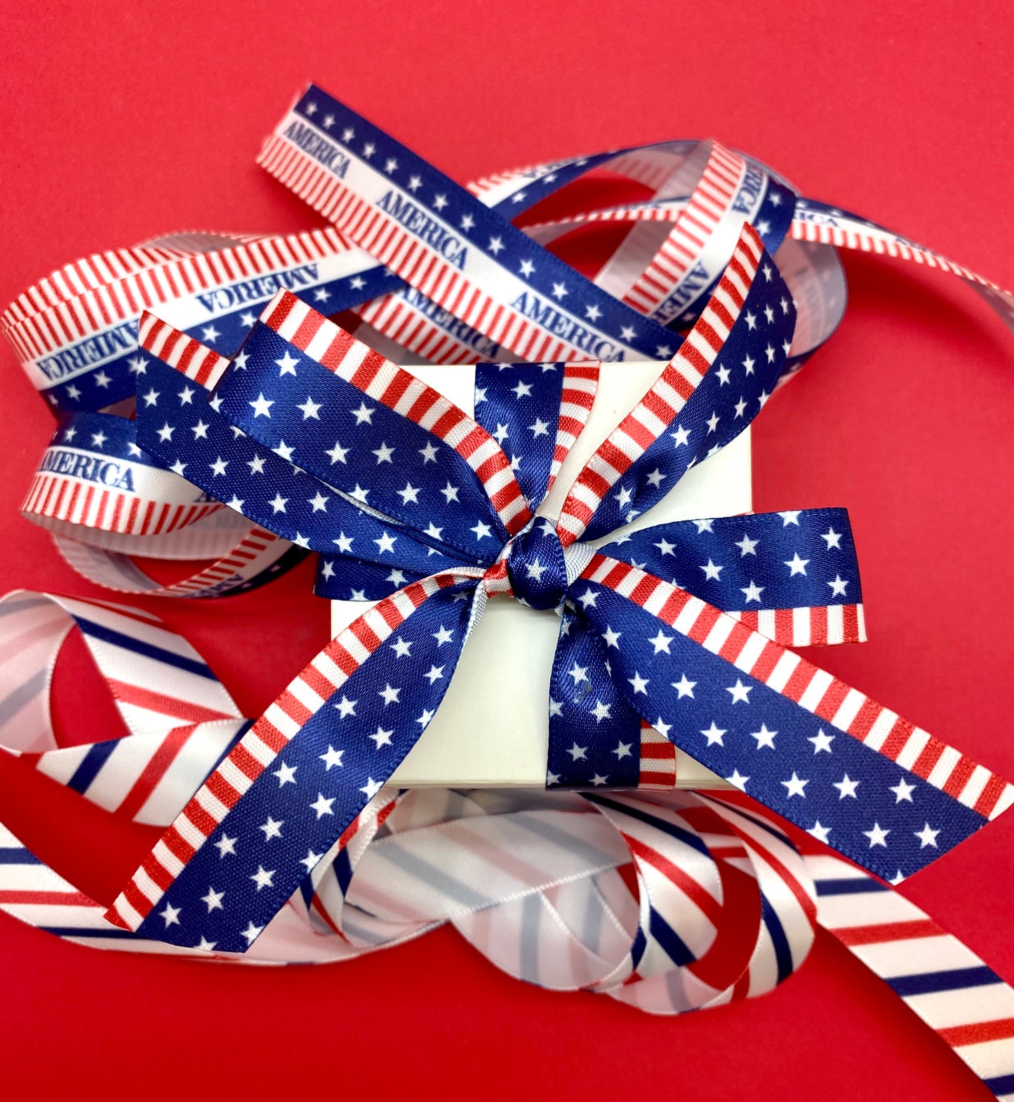 America banner ribbon with stars on a blue background and red stripes printed on 5/8" white single face satin