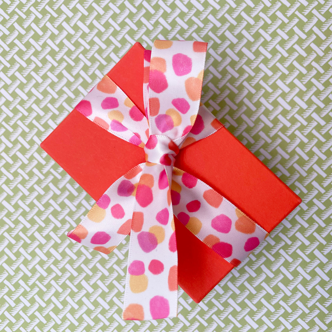 A fun little gift looks sweet with our watercolor dots ribbon tied in a  bow!
