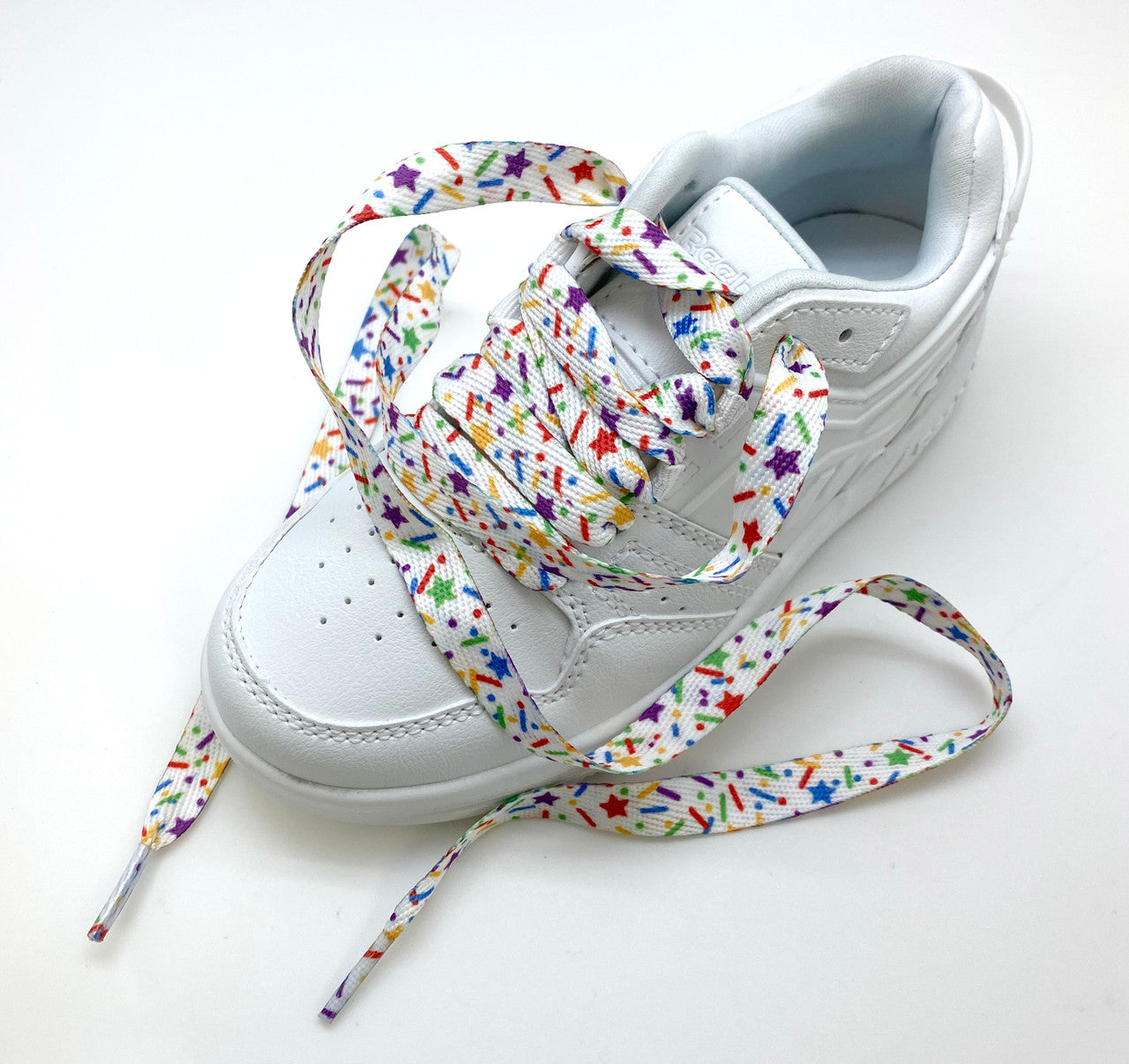 Shoelaces with sprinkles in primary colors printed on standard shoelace material 54" long