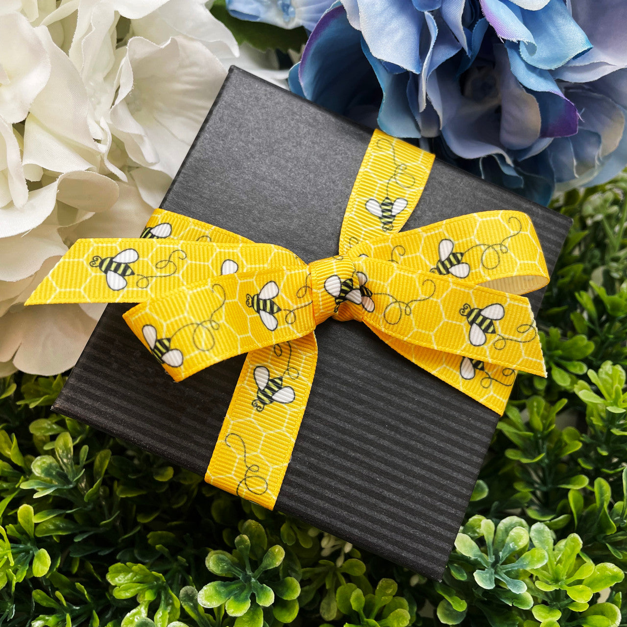 Buzzing Bees Ribbon with a yellow comb printed on 5/8", 7/8" and 1.5" white grosgrain