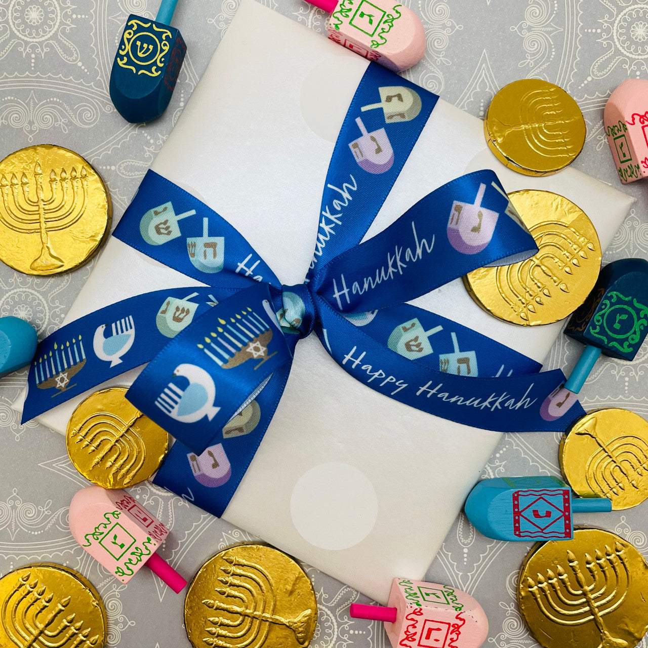 Tie our Happy Hanukkah ribbon on all our gifts for the Hanukkah gifts on your list!