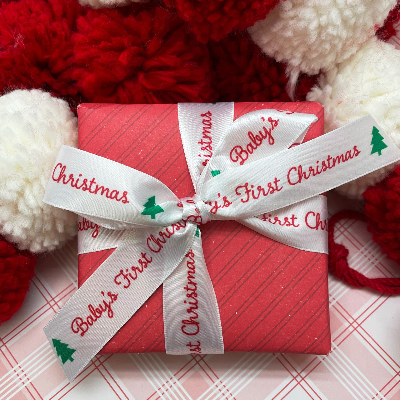 Our Baby's first Christmas ribbon is the perfect tie for Baby's gifts large and small! 