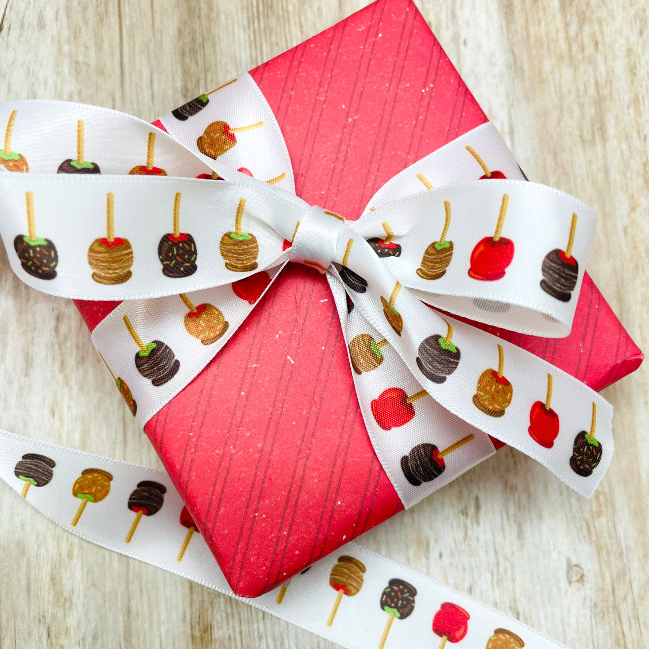 Tie a pretty Fall gift with our candy apple ribbon for a spark of fun!