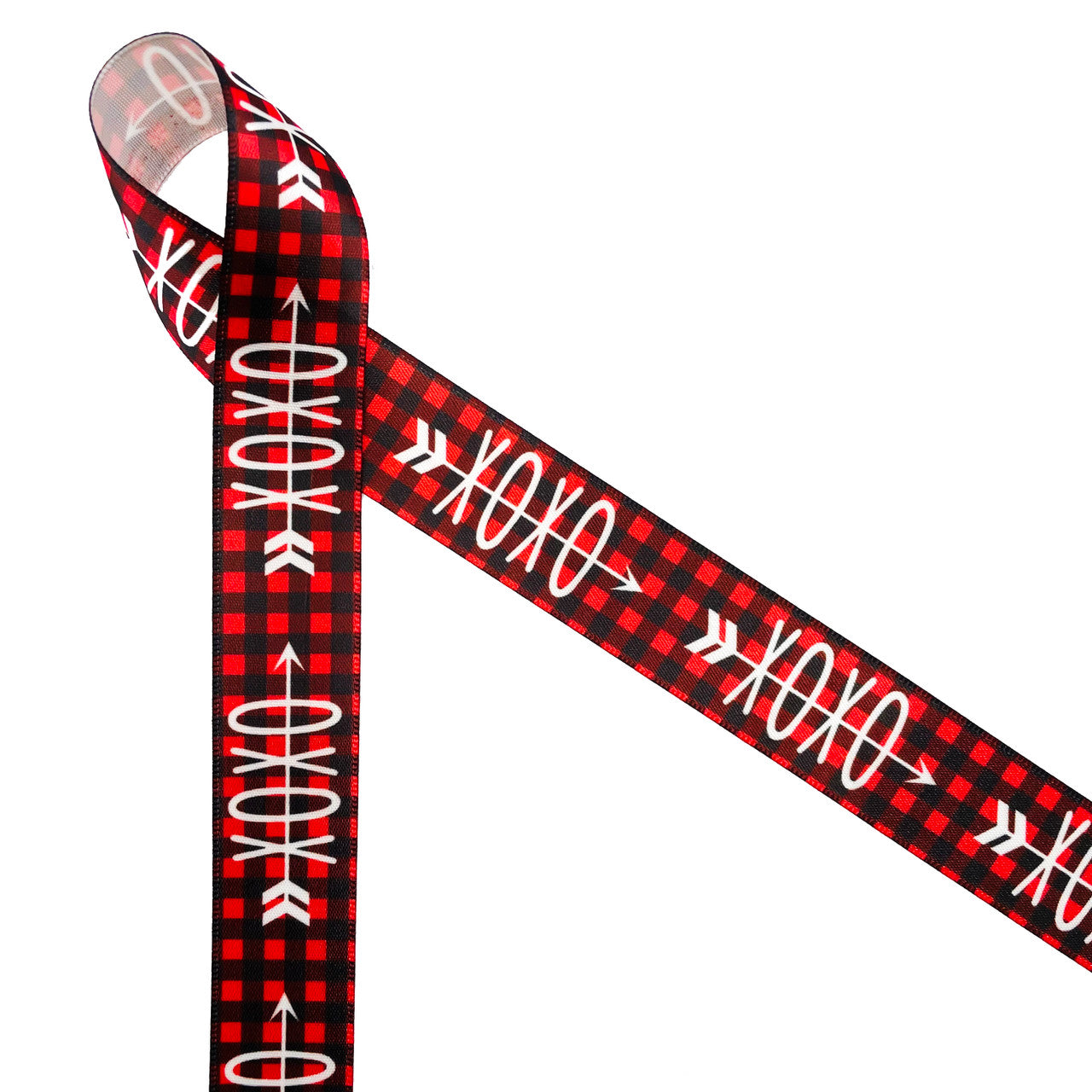 Valentine ribbon with cupids arrow through X's and O's on a red and black buffalo plaid background printed on 7/8" white single face satin is a fun ribbon for your gentleman Valentine. This is an ideal ribbon for gift wrap, gift baskets, party decor, sweet shops, candy shops, chocolatiers and bakeries. Use this ribbon on all your creative crafts including wreath making, sewing, quilting, and scrap booking. All our ribbon is designed and printed in the USA