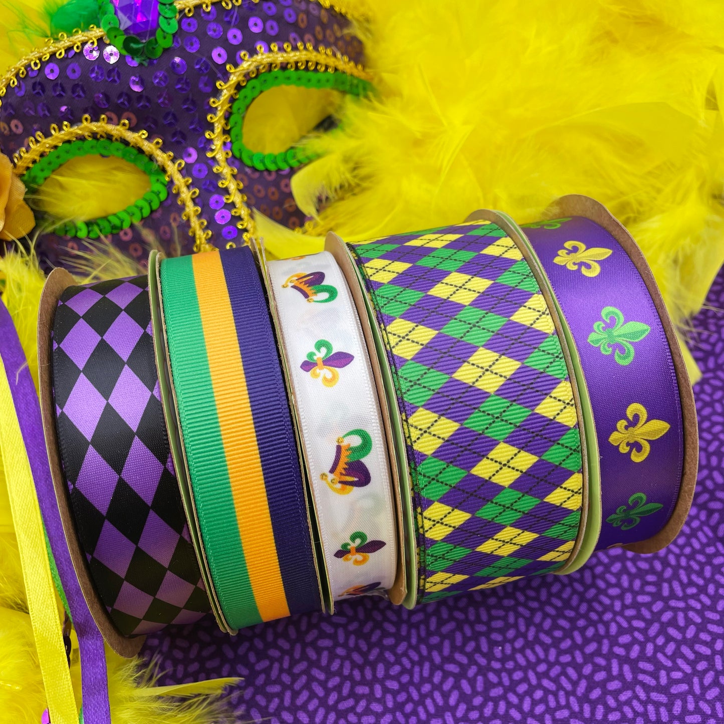 Mardi Gras argyle ribbon in purple green and yellow printed on 1.5" white single face satin and grosgrain