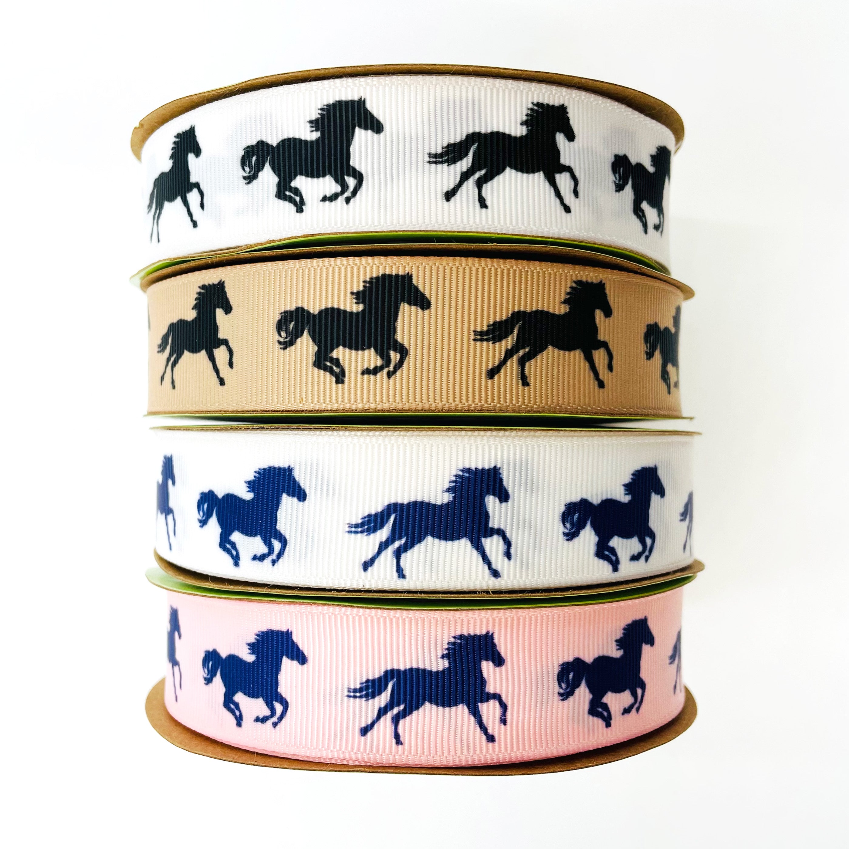 Equestrian ribbon horse shoes tossed on a navy blue background printed on  1.5 pink grosgrain, 10 yards