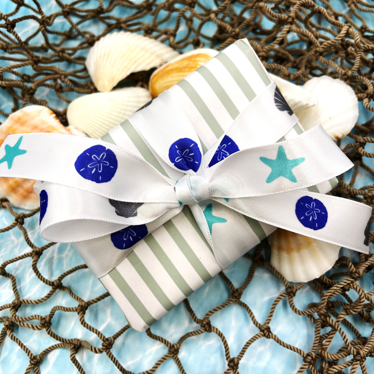 Tie a gift or party favor with our blue and white shell ribbon to complete a beach themed party in style! 