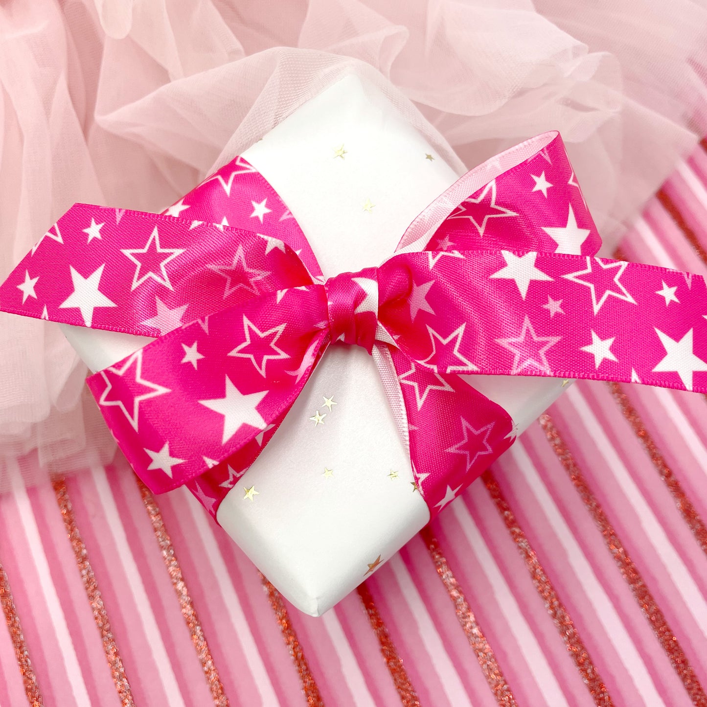 How fun is this little gift tied with our magenta and white star ribbon? Bring a smile you any girl's day with this fun package. 