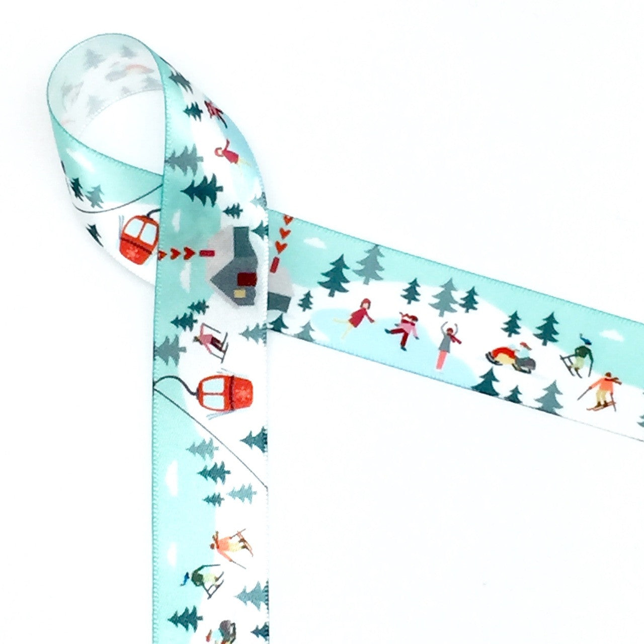 Our 7/8"  Winter fun ribbon features all the fun activities of the cold season! There is skiing, ice skating and snow mobiles along with a warming lodge for those who prefer reading by the fire! Designed and printed in the USA