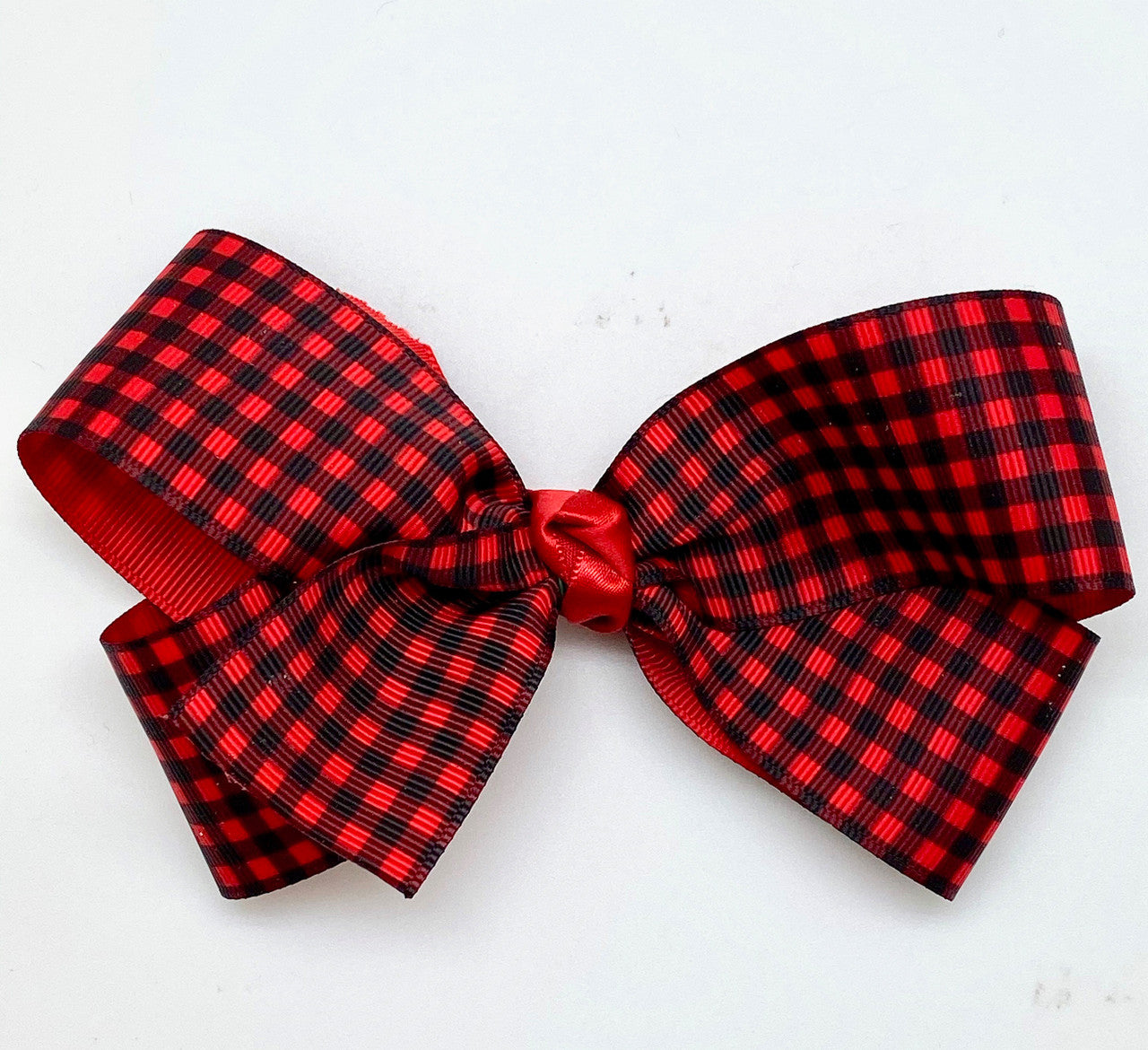 Our 1.5" grosgrain in buffalo plaid makes a perfect hair bow! Wouldn't this be such a fun Winter accessory for any little girl?