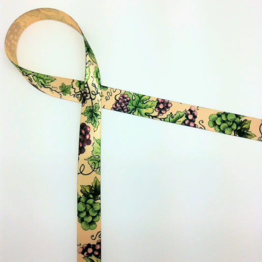 Grapes in purple with green leaves on 5/8" raw silk single face satin ribbon offered on a raw silk tan ribbon.