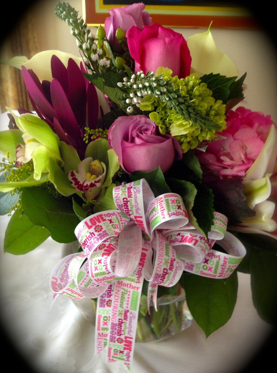 Our Mother's Day ribbon creates the ideal bow on this flower arrangement!