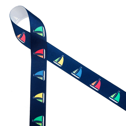 Sailboats with colorful billowing sails on a navy blue background printed on 7/8" grosgrain ribbon is a must for Summer seaside and lake side soirees! This is an ideal ribbon for gift wrap, party decor, favors and Summer crafting! All our ribbon is designed and printed in the USA!