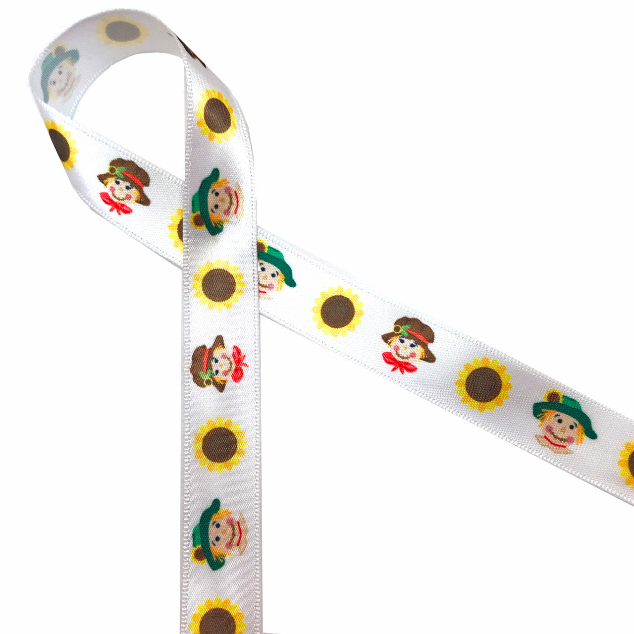 Scarecrows with sunflowers wearing fun little hats printed on 5/8" white single face will add lots of fun to your Fall crafts, packages, floral pieces, gifts and sewing projects. This is also a great width for cookies, treat bags and cake pops too ! Our ribbon is designed and printed in the USA