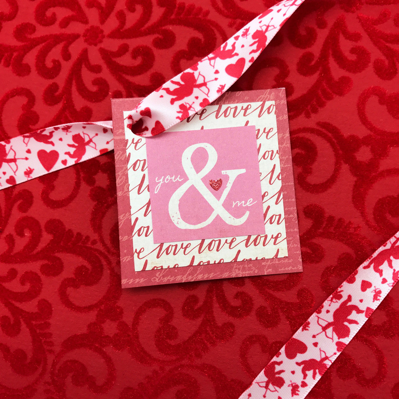 Valentine ribbon cupid ribbon, cupid, hearts and arrows in red printed on 5/8", 7/8" and 1.5" pink satin