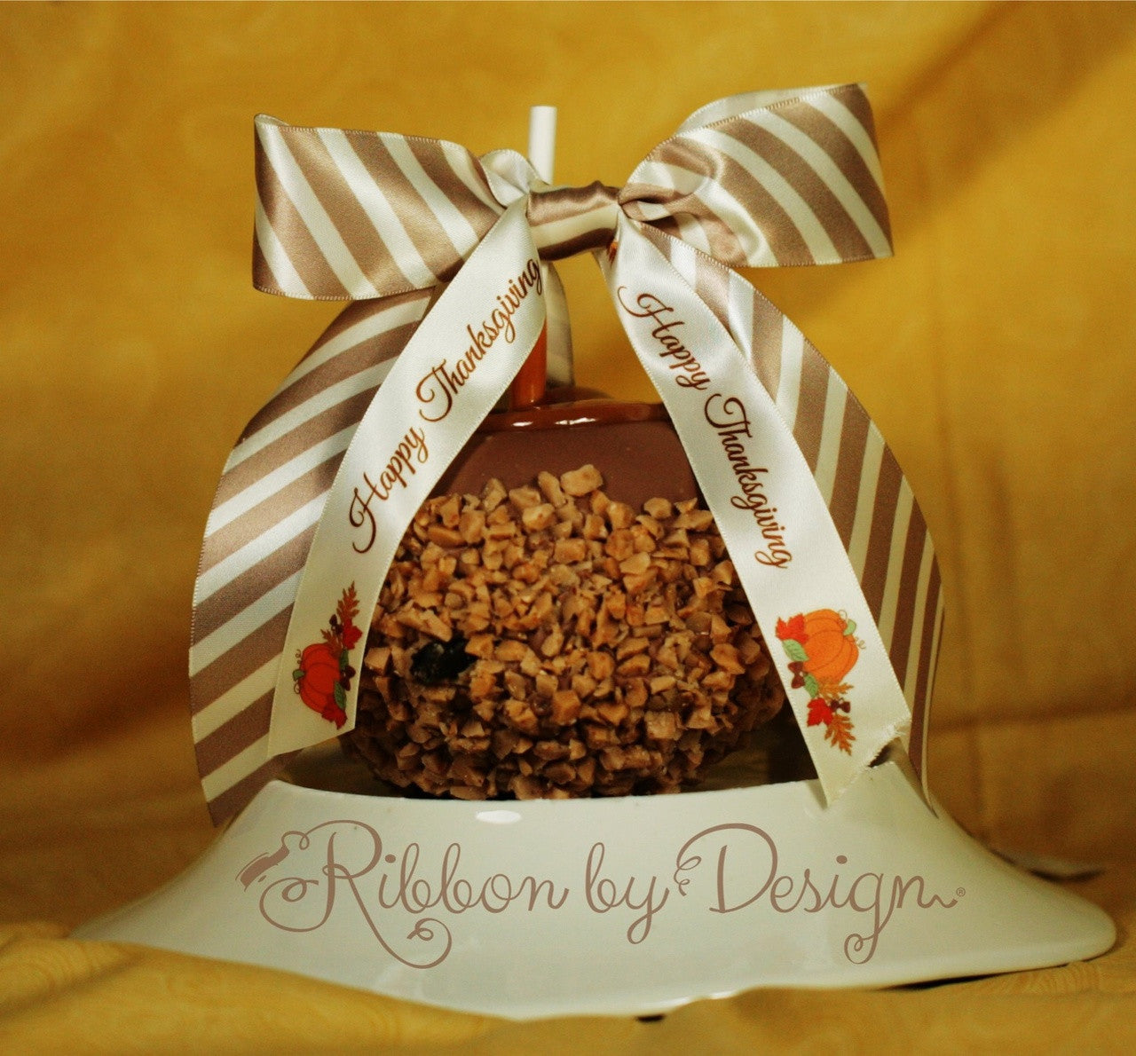 This delicious caramel apple dressed up in our champagne stripe and Happy Thanksgiving ribbon makes the perfect hostess gift!