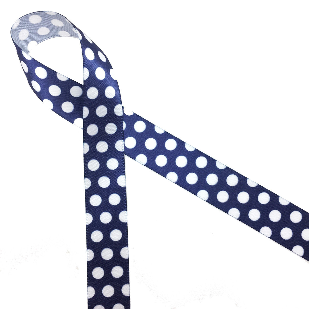 White polka dots on a navy blue background printed on 7/8 white single  face satin, 10 yards
