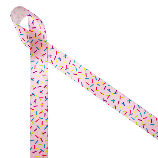 Sprinkles ribbon sprinkles in rainbow colors on a pink background printed on 5/8" white single face satin