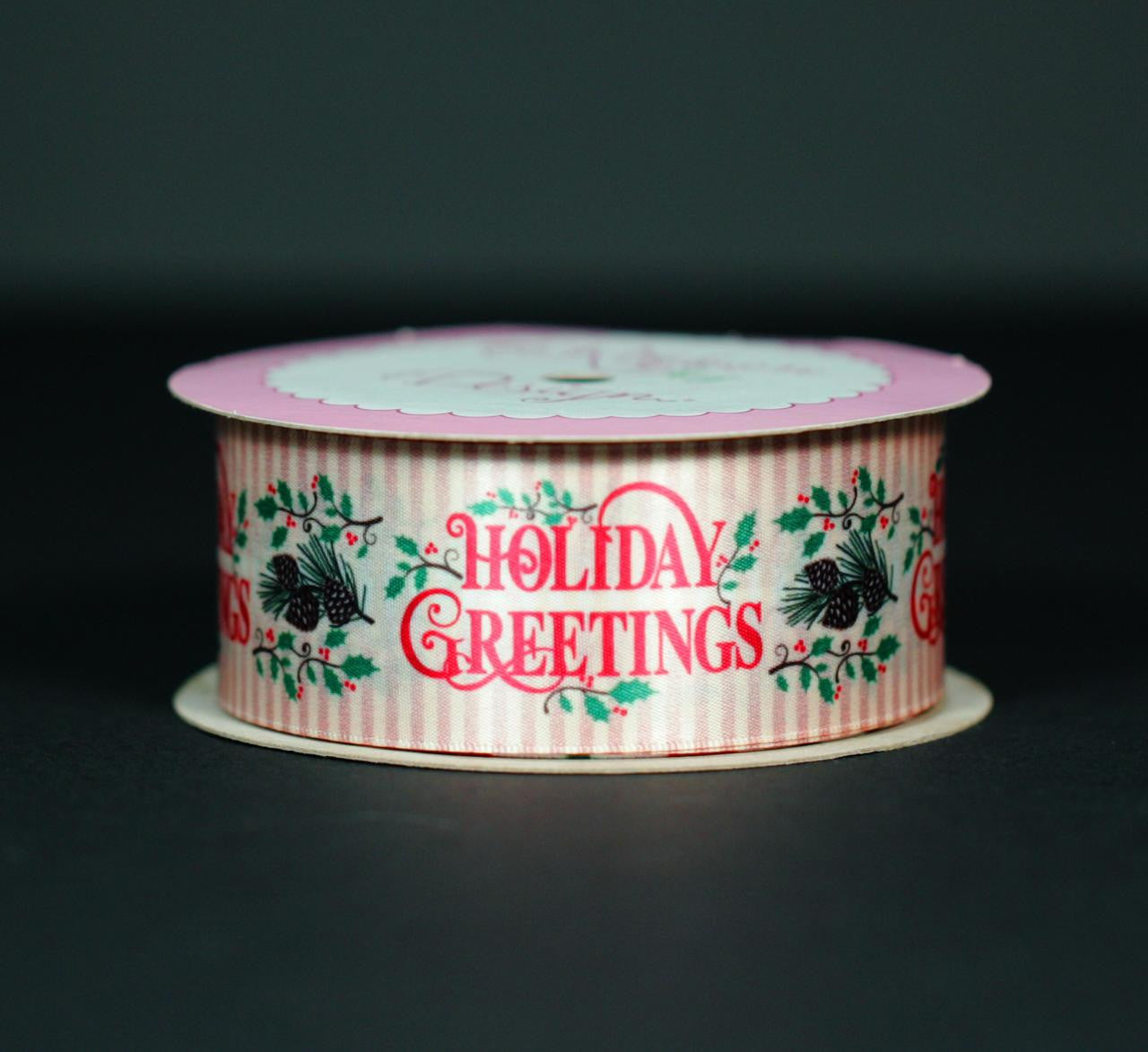 Holiday Greetings in Red on a golden striped background with pine cones, holly and white pine branch bring back a vintage holiday look. This is the ideal ribbon for a truly elegant package.