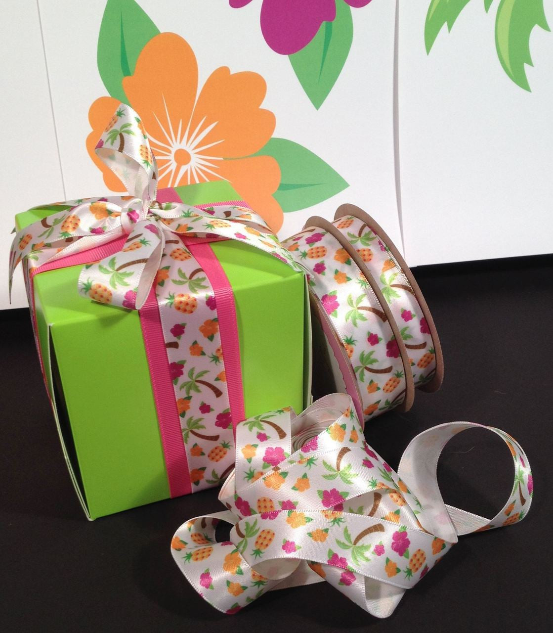 A pretty package always adds to the decor. The hawaiian theme is carried out tin the favor boxes beautifully with our ribbon!