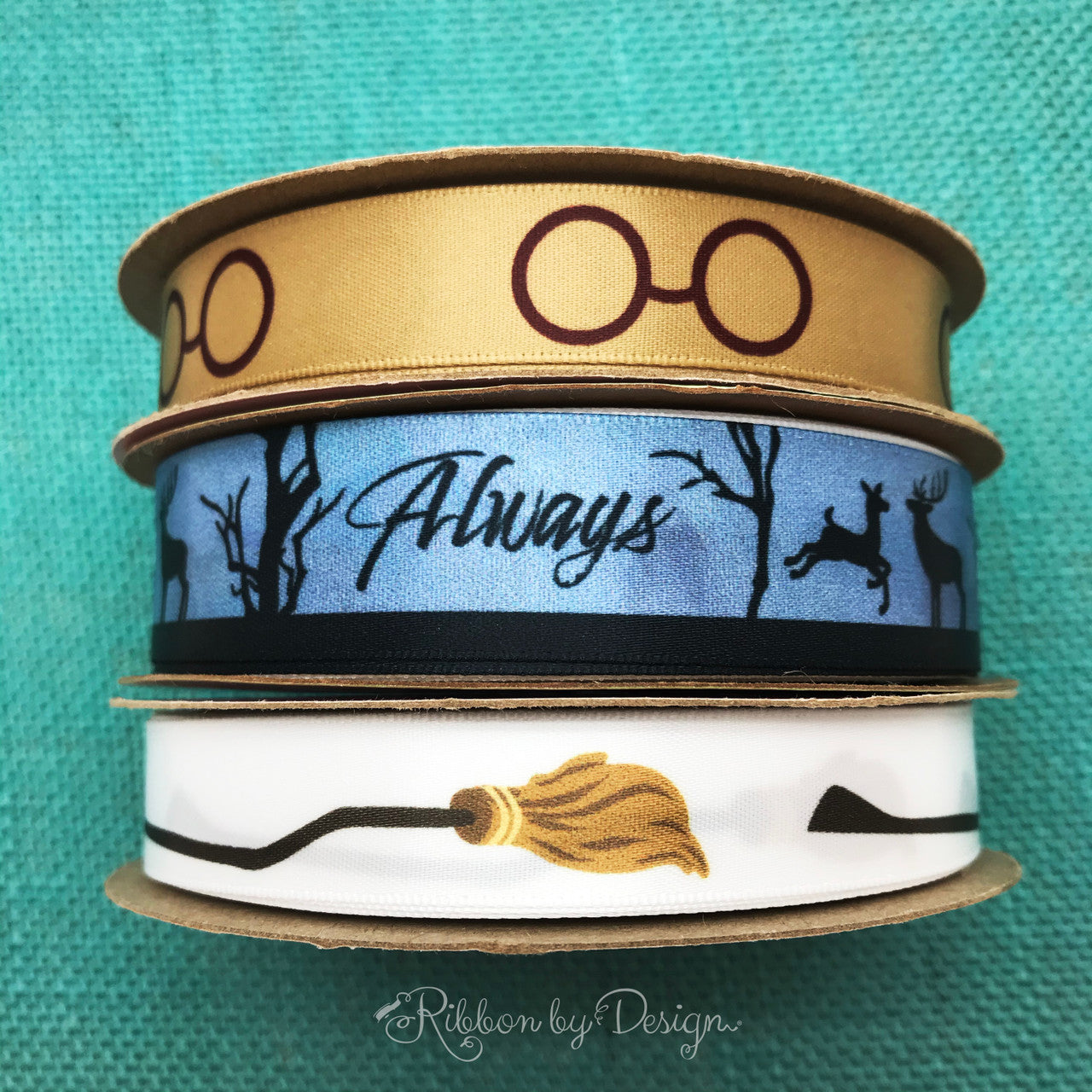 Wizard Always ribbon with doe and buck in black on a blue background  printed on 7/8 white satin ribbon