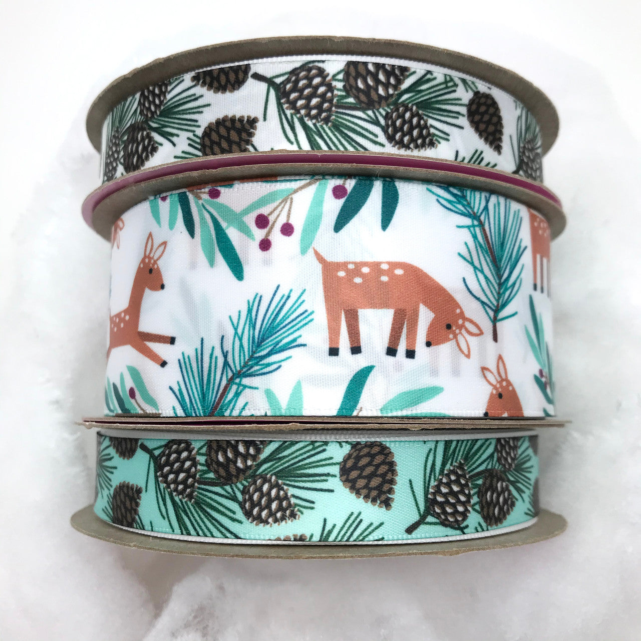 Mix and match our  Winter pine cone themed ribbons with our Woodland Deer for the perfect Winter gift wrap, home decor, floral arrangements and craft projects!