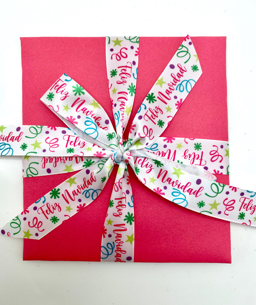 Wrap a festive gift in pink to add warmth and fun to your holiday packages!