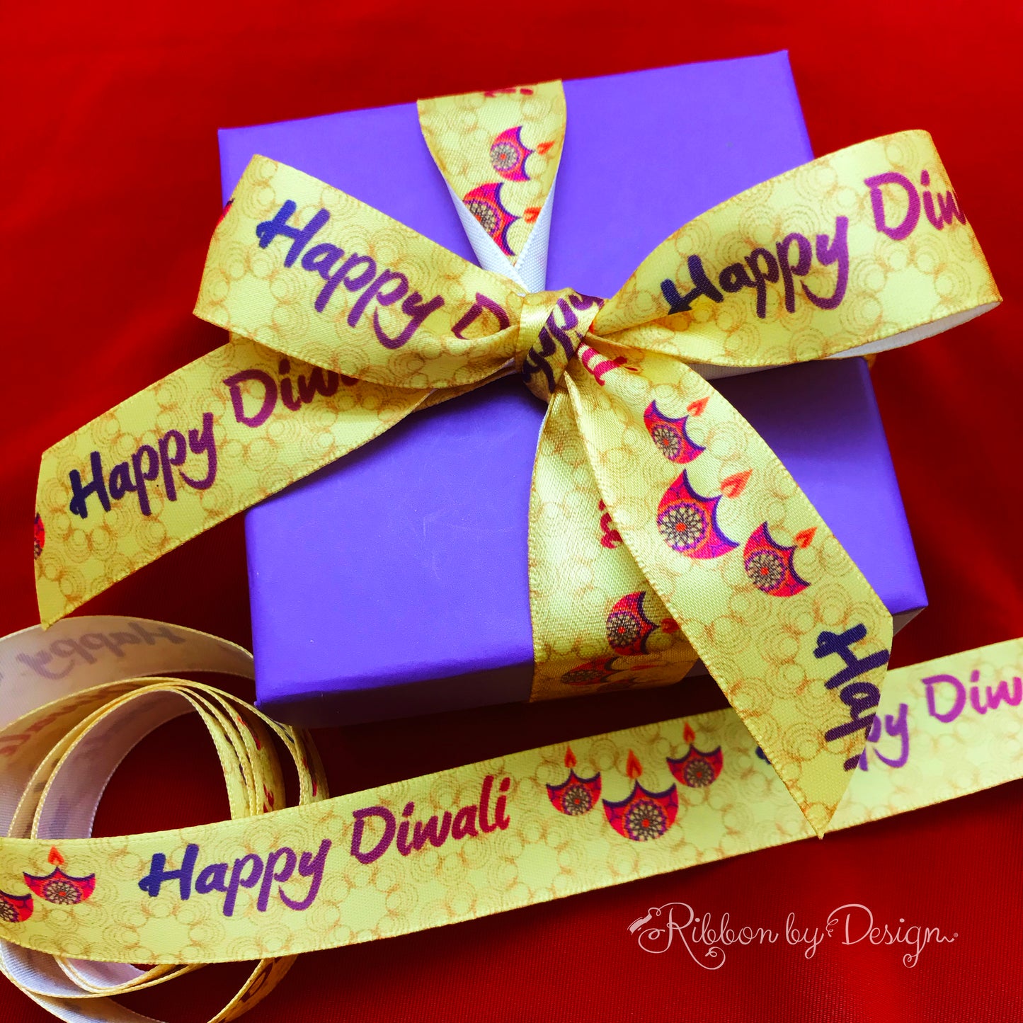 Happy Diwali ribbon with pink lamps on a yellow swirled background printed on7/8" white single face satin