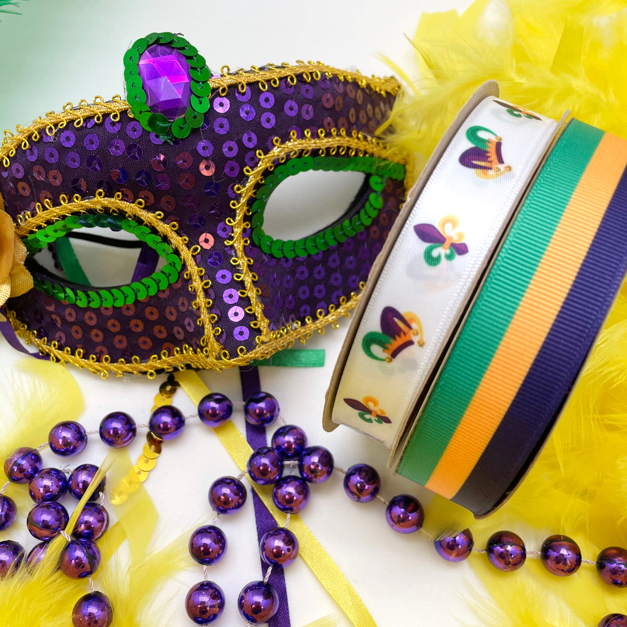 Our jester hats and stripes work together for the perfect gift wrap with a Fat Tuesday theme.