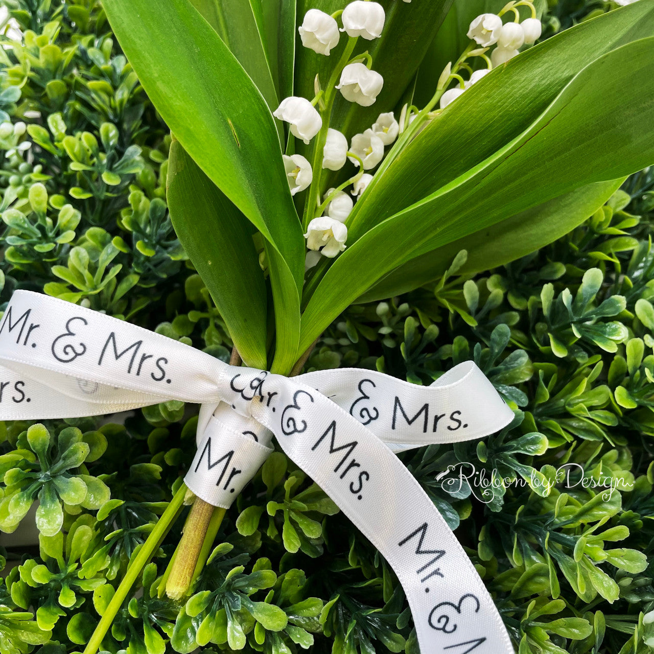 A simple lily of the Valley is elevated in elegance  with our Mr and Mrs ribbon in black and white!