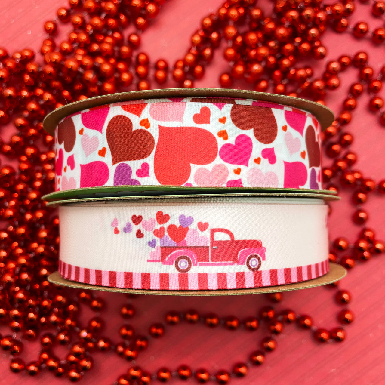 Our Valentine truck ribbon pairs perfectly with tossed hearts! Make a gift extra pretty by combining these two ribbons on the package! The recipient will love it!