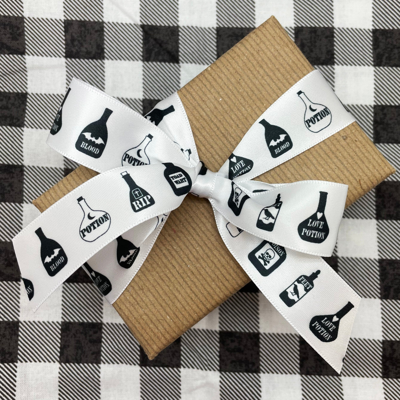Tie a pretty bow with our black and white potion bottle ribbon for beautiful gift wrap and favors!