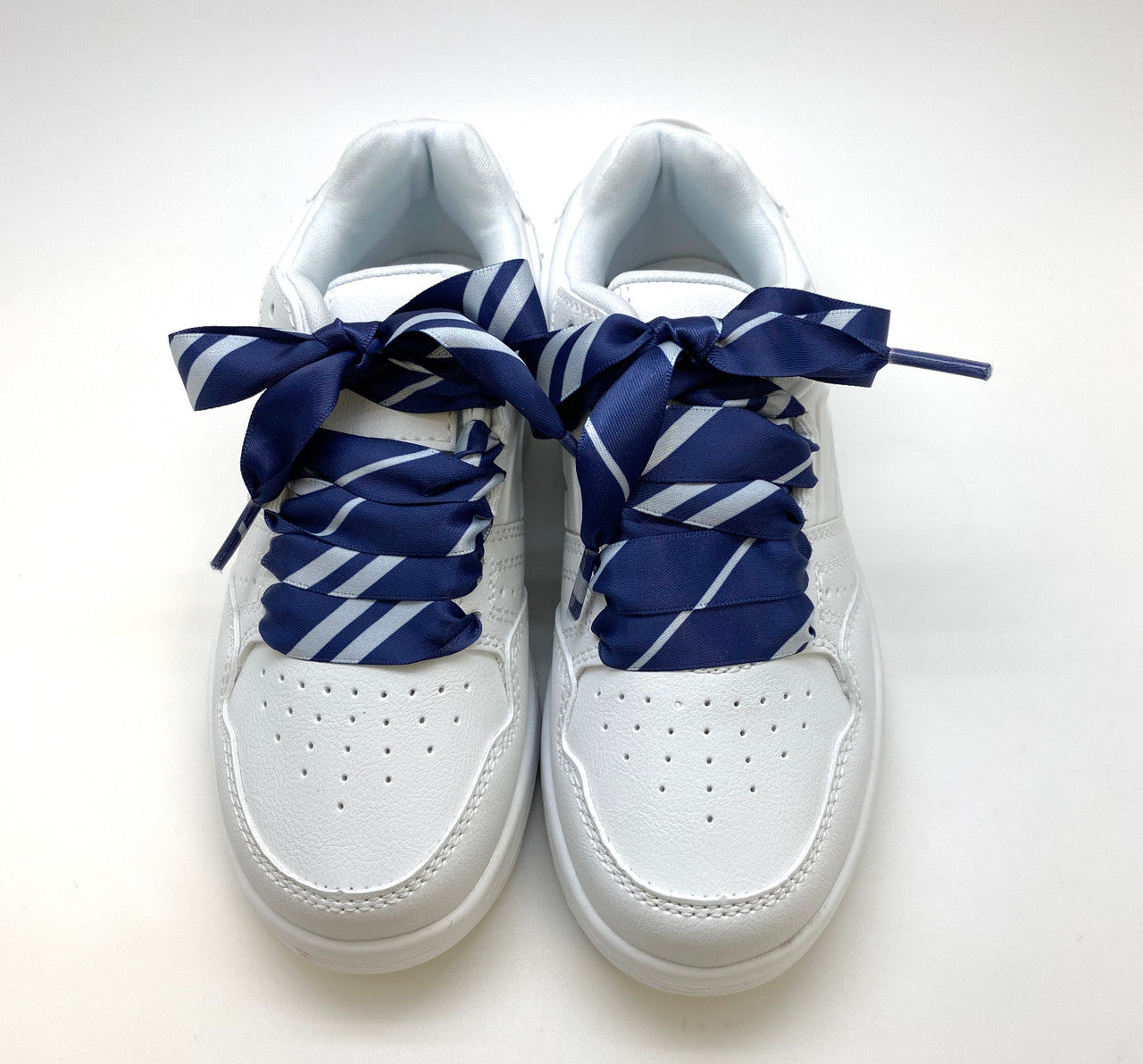 Satin shoelaces tie navy blue and silver stripe design is perfect for adding some fun and fashion to your sneakers! This is a great shoelace for fun dance shoes, wedding shoes, cheerleading and recitals! All our ribbon shoelaces are printed using dye sublimation technology and can be washed, ironed and re-used! All our laces are designed and printed in the USA