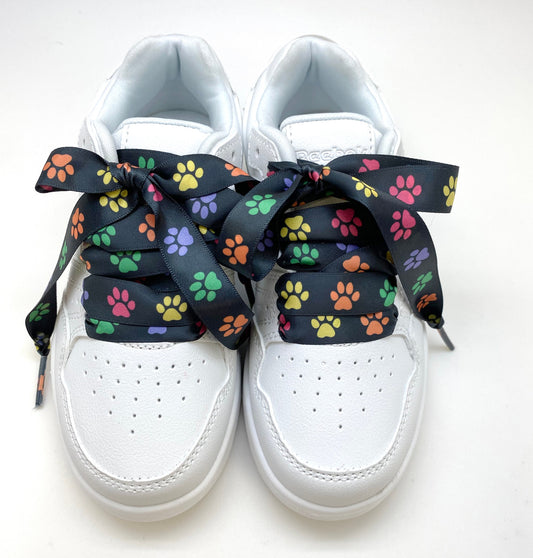 Satin shoelaces rainbow paw print  design is perfect for adding some fun and fashion to your sneakers! This is a great shoelace for fun dance shoes, wedding shoes, cheerleading and recitals! All our ribbon shoelaces are printed using dye sublimation technology and can be washed, ironed and re-used! All our laces are designed and printed in the USA