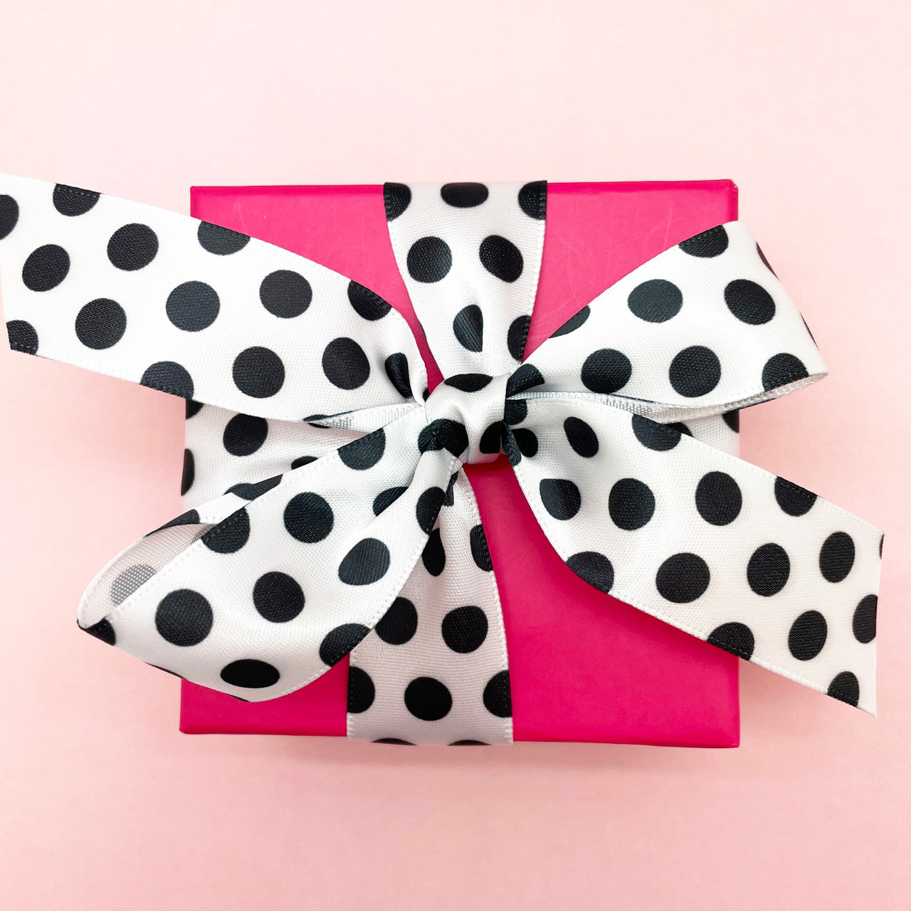 There's nothing prettier than black and white and pink! This little pink box looks oh so sweet tied with our black and white ribbon!