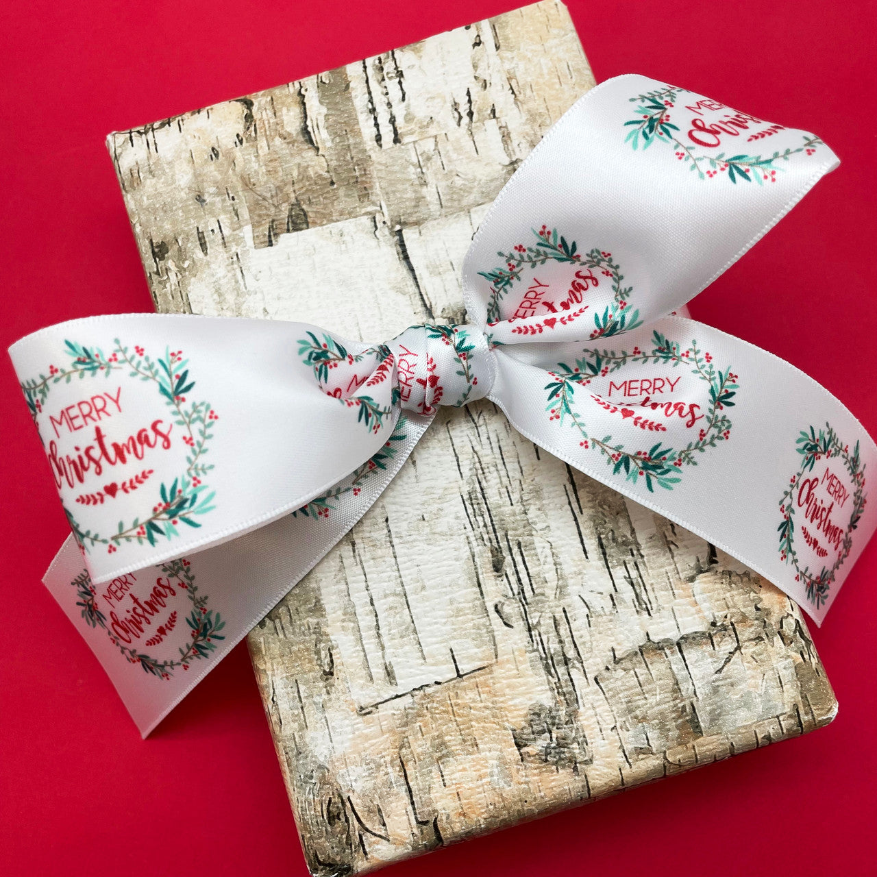 Tie our Christmas wreath ribbon in a beautiful bow for the perfect gift wrap!