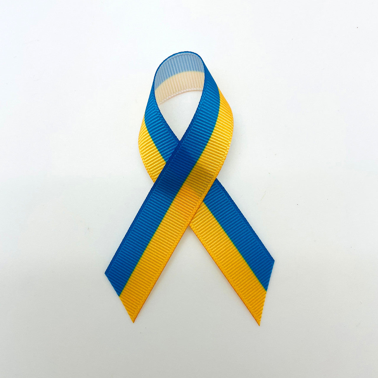 Our Ukraine flag ribbon is perfect for lapel pins bringing awareness to and honoring those suffering in the Ukraine during this time of war.