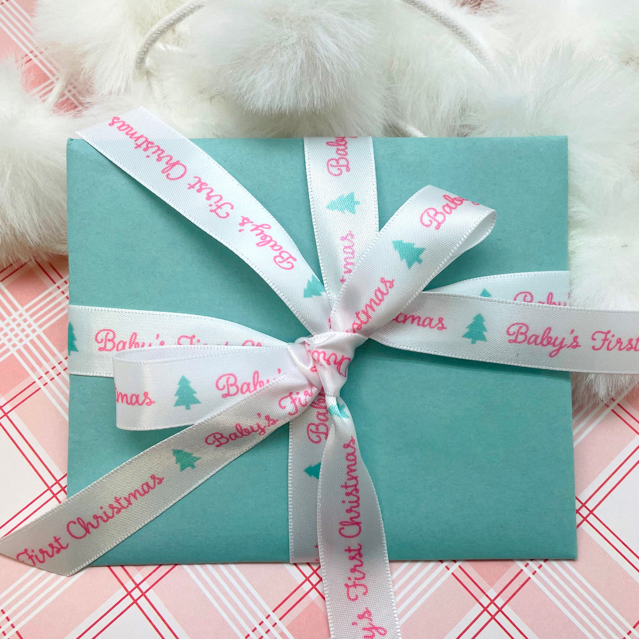 Our Baby's first Christmas ribbon is the perfect tie for Baby's gifts large and small! 