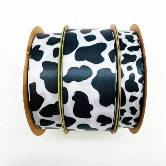 Cow print ribbon in black and white printed on 5/8", 7/8" and 1.5" white  satin