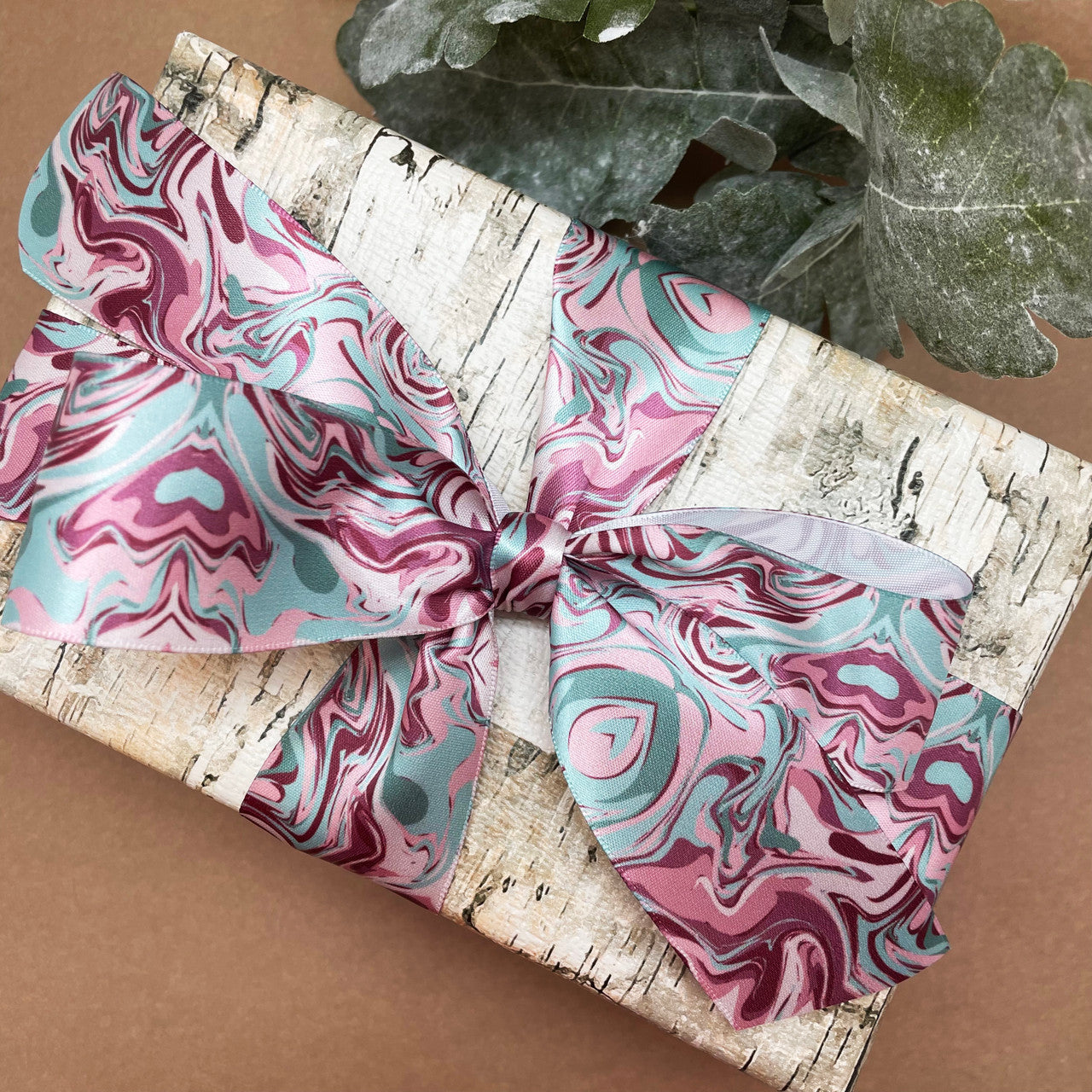 Marbled ribbon in mauve and green printed on  1.5" white satin makes a gorgeous bow for gift wrap and more! 