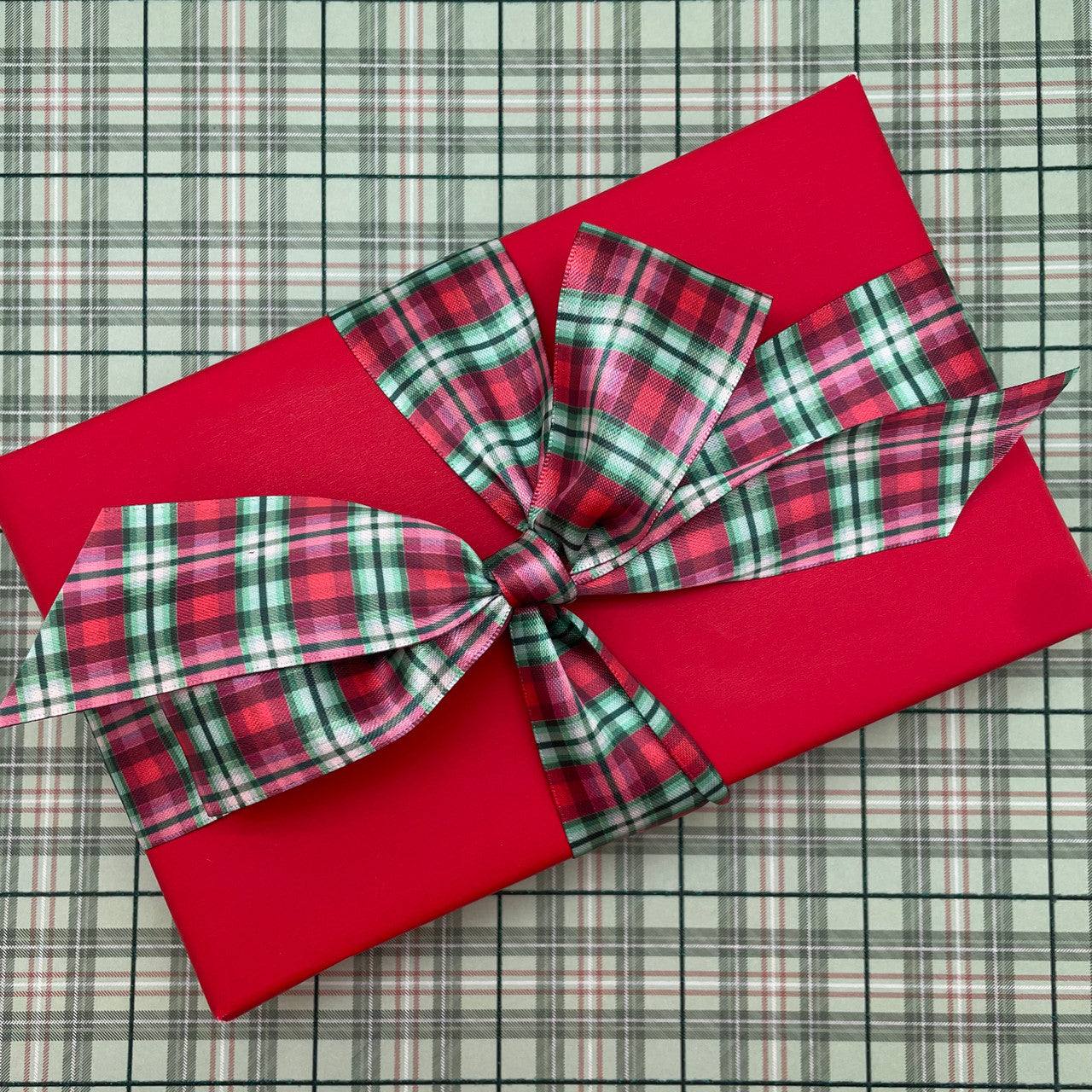 Holiday Plaid ribbon in shades of green and red printed on 1.5 white  single face satin