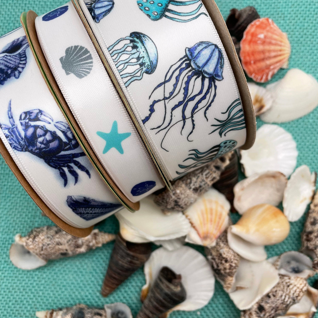 Combining our blue beach, ocean and seafaring themed ribbons of sea creatures, jelly fish and seashells in all different widths will create a beautiful beach themed party decor! 