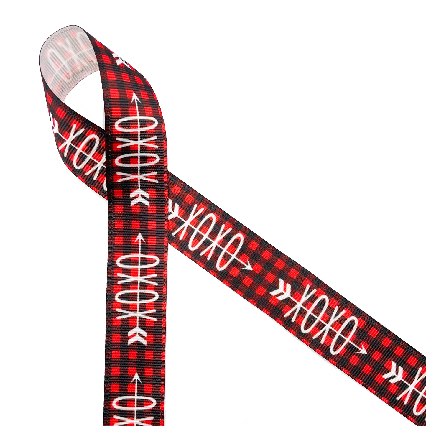 Valentine X's and O's in white on a red and black buffalo plaid background printed on 7/8" white single face satin and grosgrain