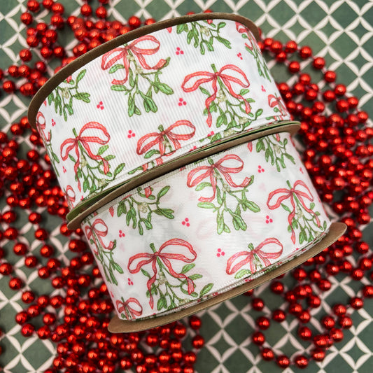 Holiday Mistletoe ribbon with delicate green mistletoe with white berries and red bows printed on 1.5" satin and grosgrain