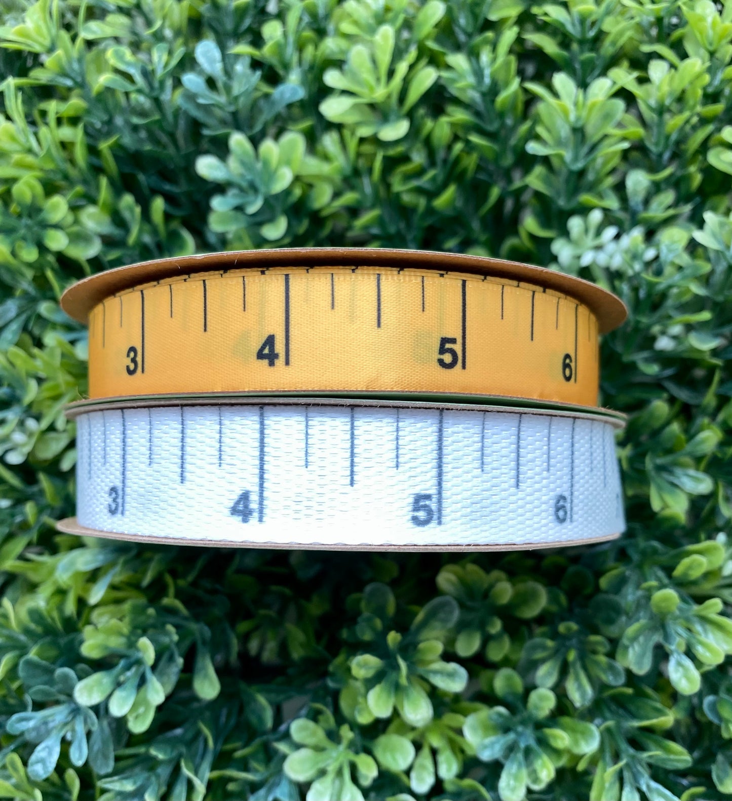 Measuring tape ruler ribbon black lines and numbers printed on 5/8" yellow gold satin and white woven fabric