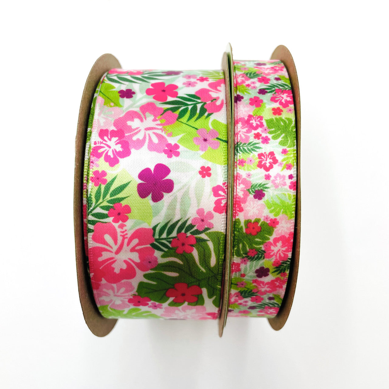 Our beautiful pink and green floral and fern ribbon is available in 5/8" and 1/5" single face satin for all your party needs! 
