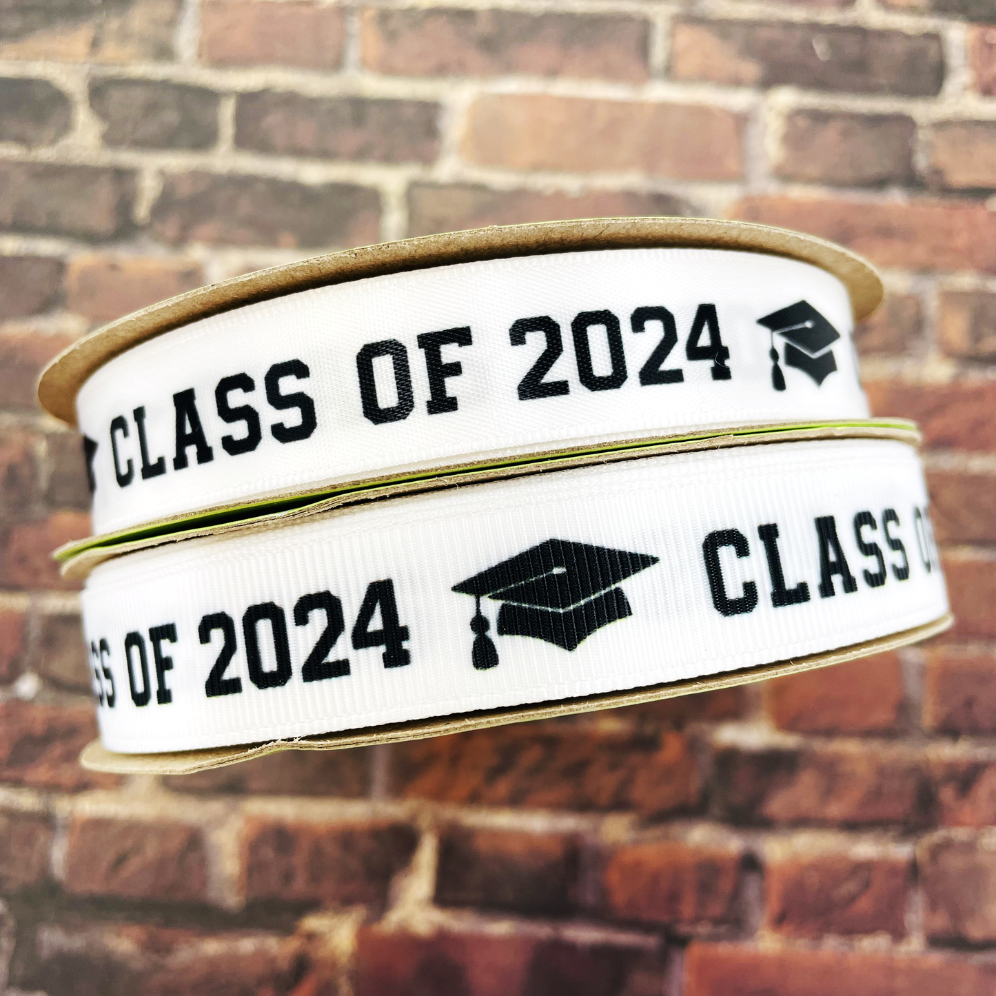 Graduation Class ribbon Class of 2024 in black with a black mortar board printed on 5/8" and 7/8" satin and grosgrain